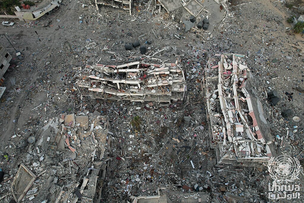 Aerial view of heavily damaged, collapsed buildings caused by Israeli airstrikes in Al-Zahra, south of Gaza City